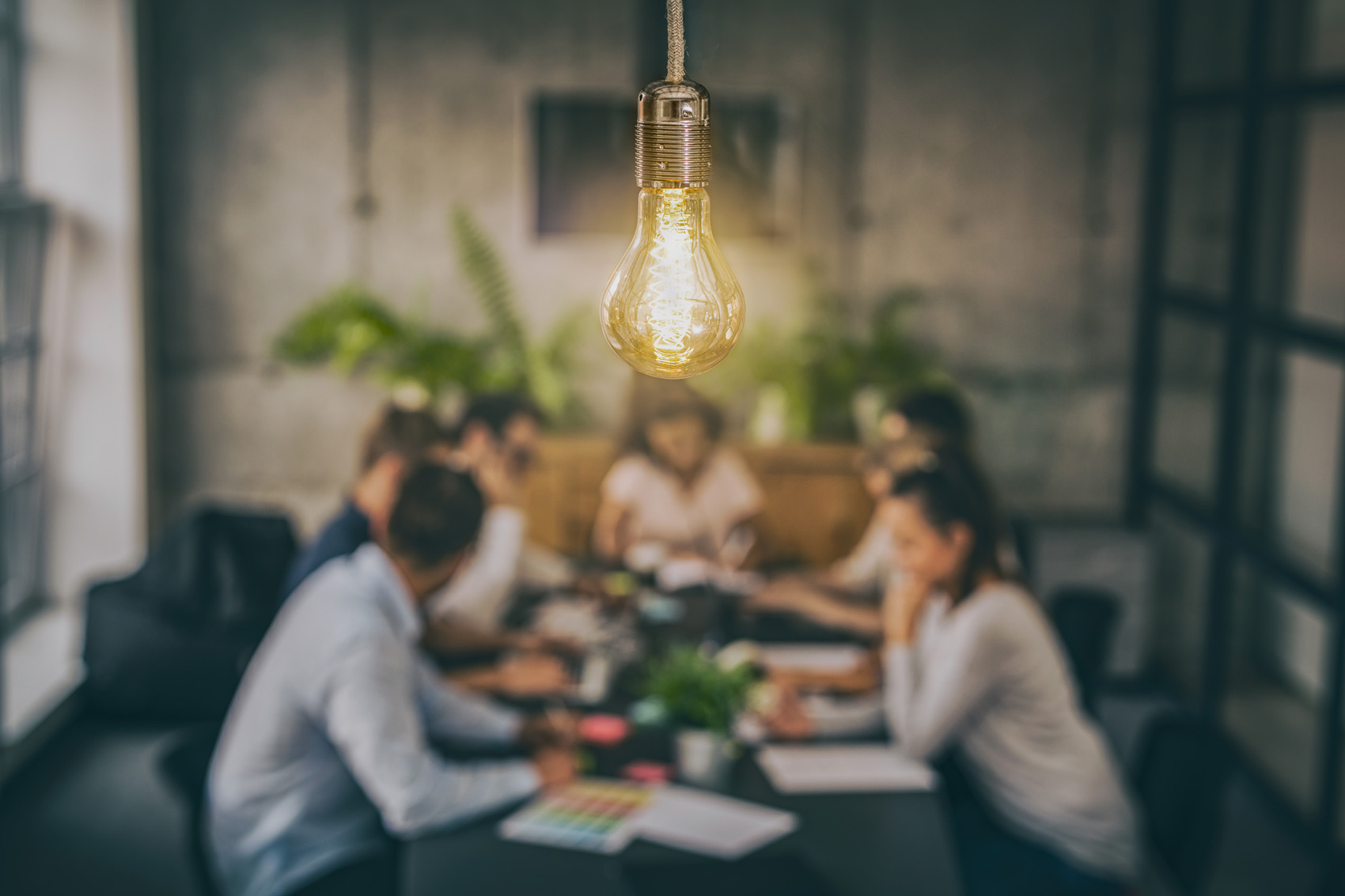 How To Effectively Market Your Membership Offerings - Lightbulb Lit Up Over Desk