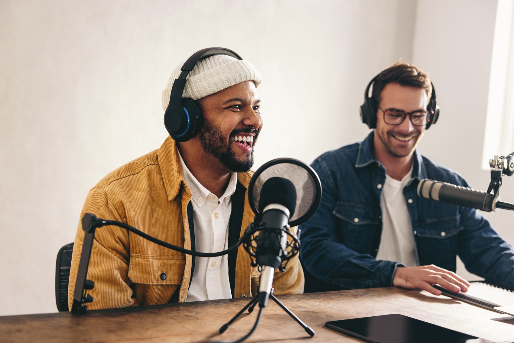 Ways Business Owners Use Podcasts to Grow - Two Men With Headphones and Microphone