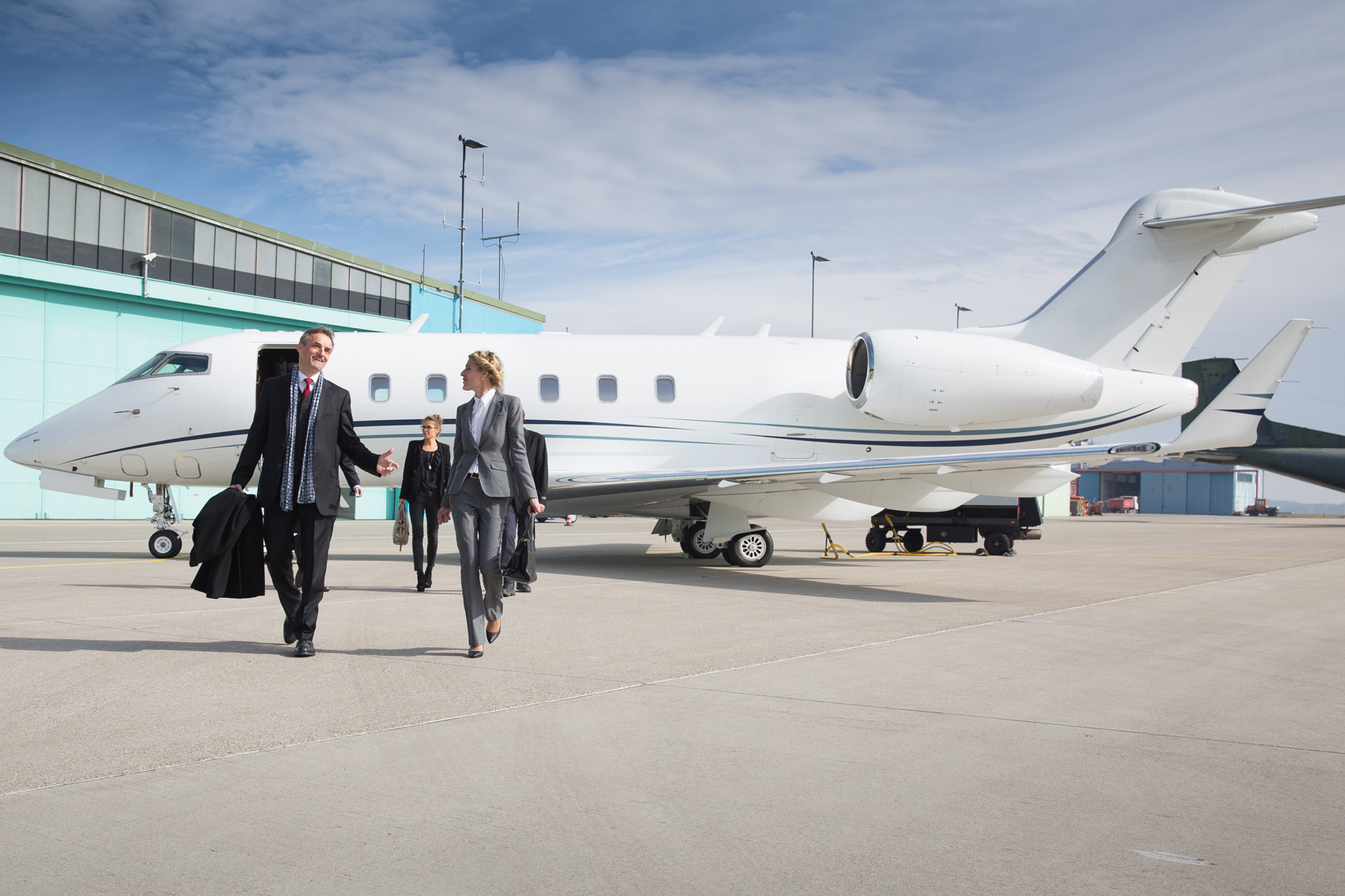 Business Executives Leaving Private Jet
