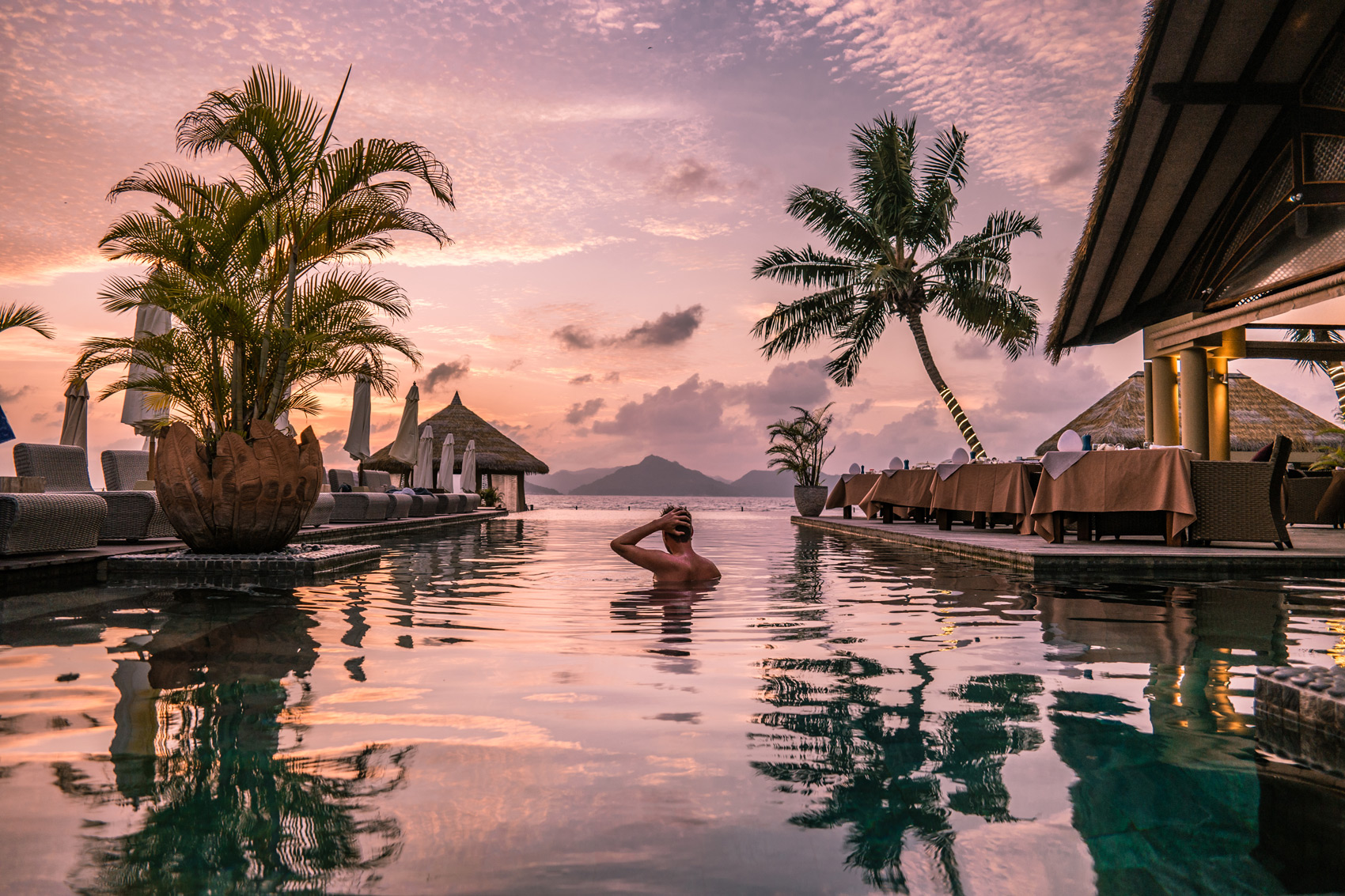 The Benefits of Using a Luxury Travel Concierge Service for Members - Young Man At Tropical Beach 