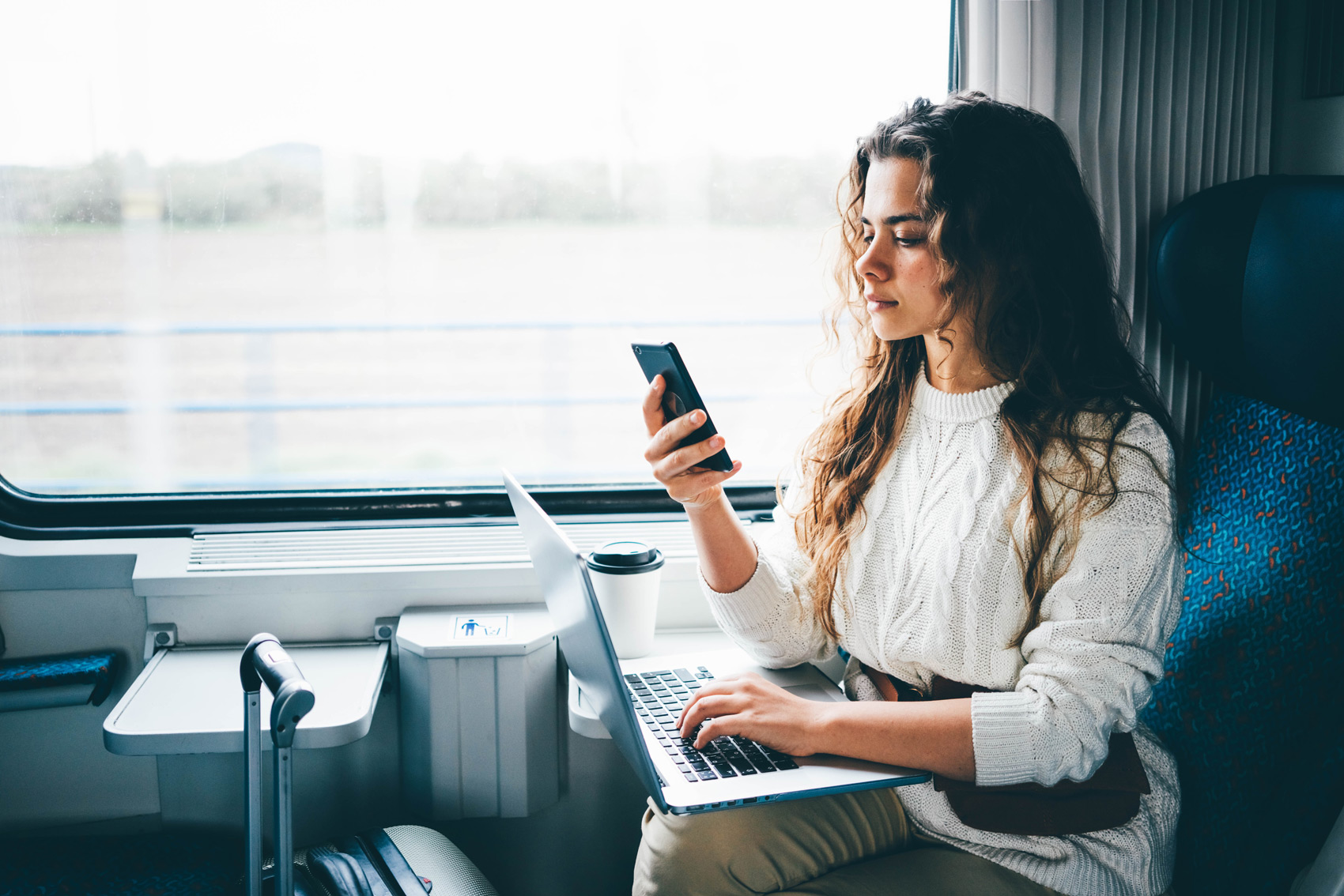 Travel Services Every Executive Needs - Woman Business Leader in Virtual Meeting on Train
